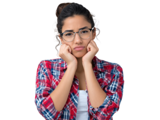Woman in Thoughtful Pose: A young woman, with a serious expression, rests her chin in her hands, looking pensive and thoughtful, framed with stylish glasses and a plaid shirt, captured in studio.