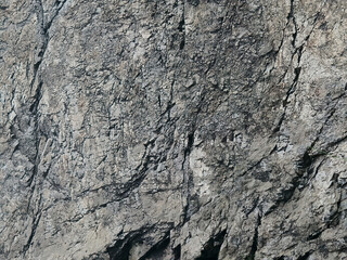 Natural  gray dark rough grainy stone texture background, backdrop 