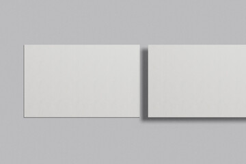 Blank business card mockup on a grey background. 85x55 mm. 