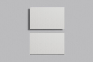 Fototapeta premium Blank business card mockup on a grey background. 85x55 mm. 
