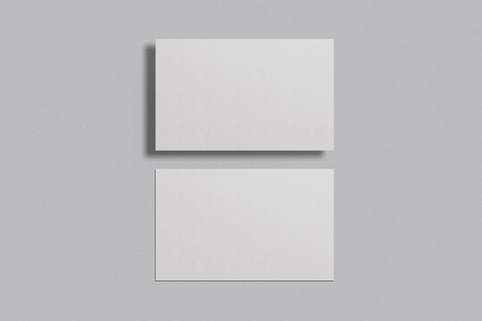 Blank business card mockup on a grey background. 85x55 mm. 