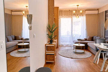 Modern living room with cozy design: elegant furniture, warm lighting, and relaxing décor