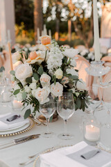 Elegant floral wedding arrangement with white lilies and roses