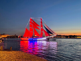Saint-Petersburg, Russia - June 11, 2023. Rehearsal of the Scarlet Sails festival. Beautiful Brig Russia pass along the Neva River during the white night.