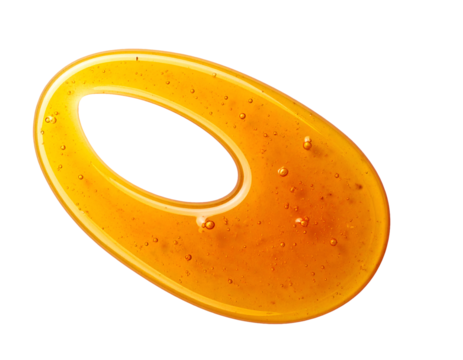 top view of glossy honey oval ring with inner hole, isolated on black
