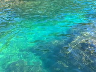 Turquoise blue ocean clear water surface.