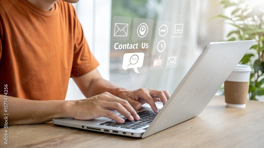 Poster hands typing on a modern laptop keyboard at a desk. virtual floating icons for contact and online co