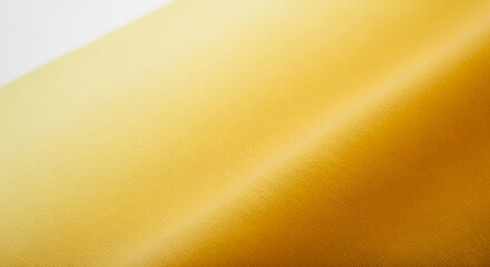 Gradient gold fabric with soft folds provides a warm, luxurious texture for backgrounds and design elements