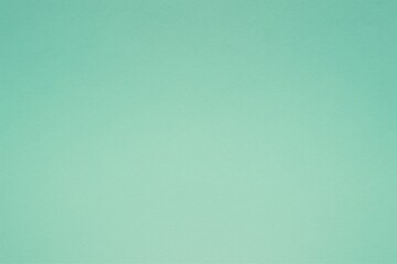 Delicate mint colored paper showcases a serene, textured background, perfect for soft, understated design projects and elegant presentations.