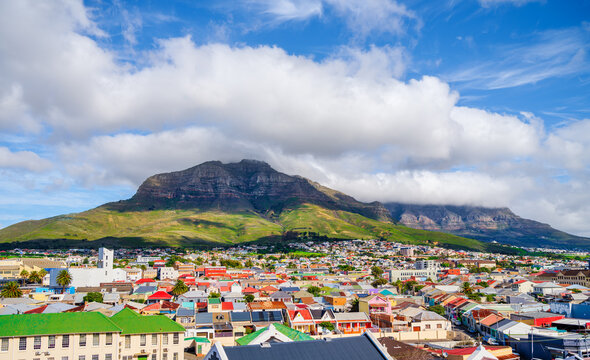 Cloud-covered Table Mountain and Devil's Peak over Woodstock houses, Cape Town, South Africa