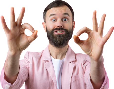 Portrait of a smiling young man in a pink jacket. Man showing ok gesture while standing in studio over isolated  background.