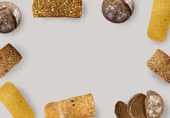 Fresh bread creative layout isolated on white background. Whole and sliced breads collection. Healthy eating and dieting food concept. Top view, flat lay. Design element, copy space.