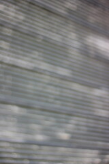 An abstract view of a silver metal background with many lines.