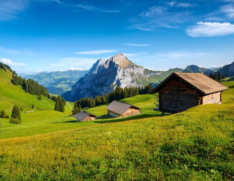 wooden huts and meadows on the schwaegalp with view of the saentis summit canton of appenzell ausserrhoden switzerland