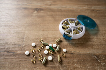 Exploring the daily routine of health management with vitamins and supplements on a wooden table