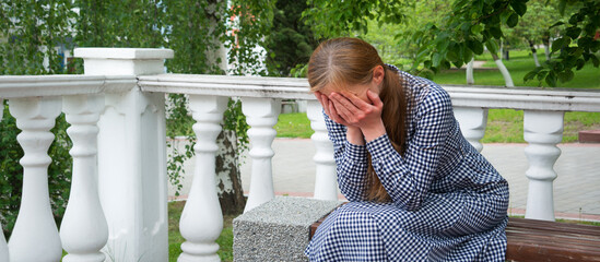 Crying woman in the park