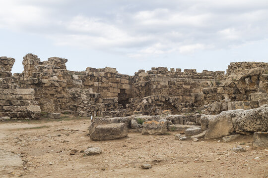 View of weathered stones and crumbling walls stand defiant against the sky, remnants of ancient history, in Salamis Harabeleri, Harabeleri Salamis Yolu, Cipro.