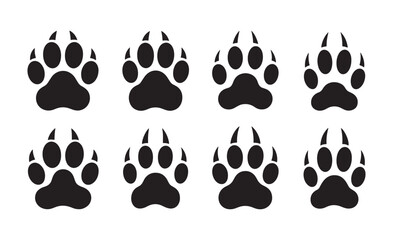 Fototapeta premium Collection of eight black paw prints on a white background
