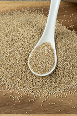 Natural white quinoa in a spoon macro