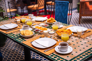 Traditional breakfast in Morocco with oranges and arabic bread