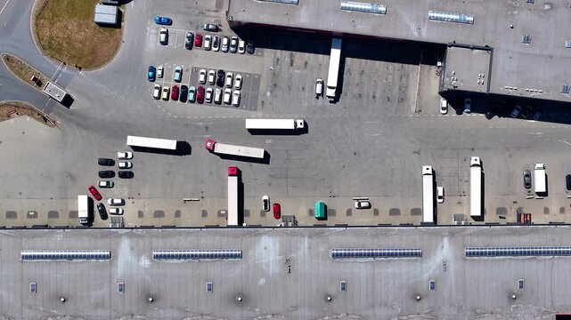 Transport dynamics at a bustling logistics warehouse under clear skies in high-quality 4K for e-commerce enthusiasts