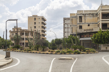 View of abandoned buildings stand as silent sentinels in a forgotten city, where nature reclaims what was once bustling, Varosha, Famagusta, Cyprus.