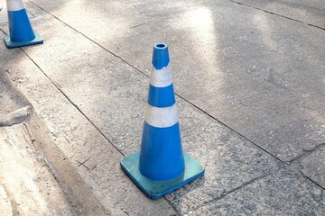 Traffic cone in blue and white colors placed on the road, Traffic Safety Equipment, highway cones,...
