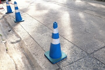 Traffic cone in blue and white colors placed on the road, Traffic Safety Equipment, highway cones,...