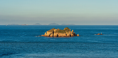 Tranquil Island Oasis Surrounded by Calm Blue Waters in a Beautiful Horizon Setting