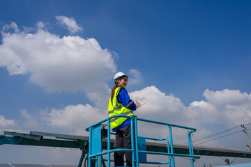 Engineers are working at solar farm.