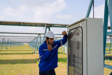 Engineers are working at solar farm.