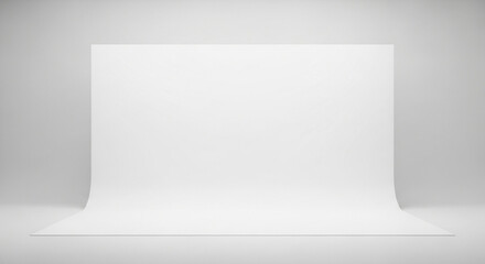 Minimalist white studio setup with a gentle sweep creates an ideal blank canvas for creative projects