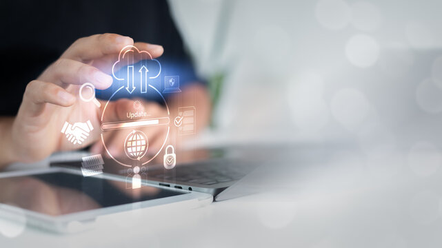Close-up of a hand updating a cloud system with digital icons representing data security, teamwork, software deployment, and global online connection in modern cloud technology.