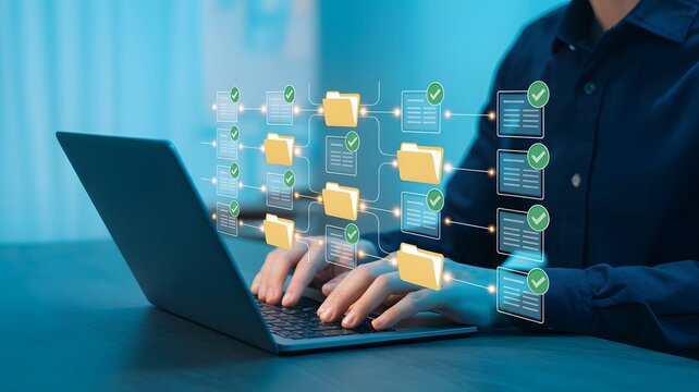 Person types on a laptop, managing digital files and folders with secure data transfer and validation in cloud computing.