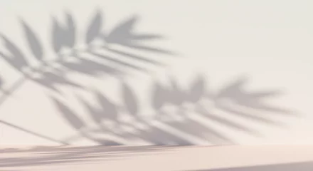 Fototapete Badezimmer Light and shadow play of tropical leaves on a pale background.  © galih