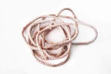 Old nylon rope roll on white background, looks frayed and crumpled.