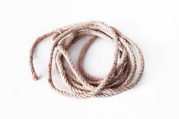 Old nylon rope roll on white background, looks frayed and crumpled.