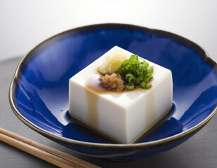 Hiyayakko (冷奴, ひややっこ) &ndash; Chilled Tofu with Soy Sauce, Ginger, and Bonito Flakes.