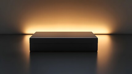 Sleek black rectangular packaging box with clean design, softly illuminated on a reflective surface, leaving space above for branding