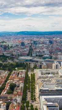 flight over vienna cityscape sunny day train station aerial vertical panorama 4k timelapse austria 