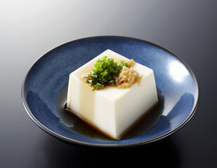 Hiyayakko (冷奴, ひややっこ) &ndash; Chilled Tofu with Soy Sauce, Ginger, and Bonito Flakes.