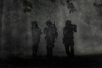 military in the forest . Special Forces Operatives Advancing Through Smoke in Jungle Terrain
