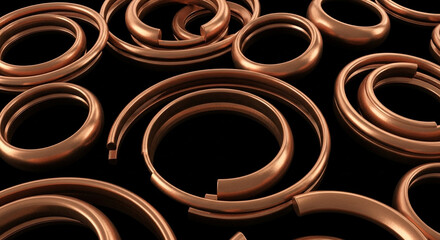 An elegant array of polished bronze rings and curved metal forms scattered across a black backdrop.