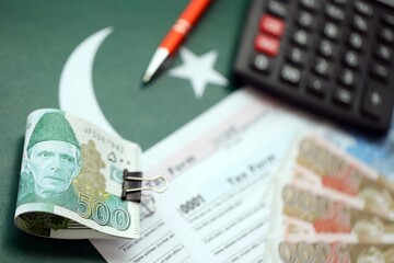 Pakistan rupees banknotes and medicine pills. Pakistan real money and tax blank close up