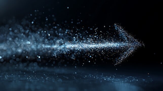 A sparkling arrow shape formed by light particles against a dark black background with reflections
