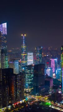flight over guangzhou city downtown night illumination traffic street aerial timelapse vertical panorama 4k china