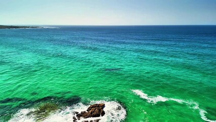 Enjoy breathtaking turquoise waters and a serene, captivating coastline while watching this...