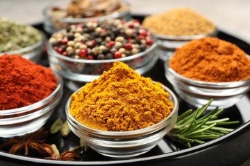 Many different aromatic spices on table, closeup
