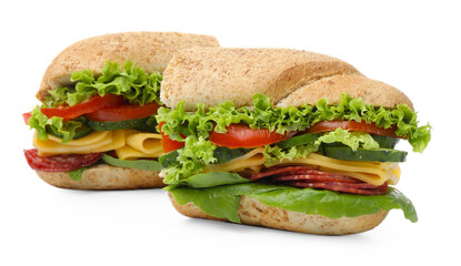 Pieces of tasty baguette sandwich with smoked sausage, cheese and vegetables isolated on white