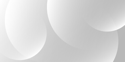 A minimalist abstract background featuring overlapping curves and circular shapes in various shades of gray, creating a smooth gradient and subtle depth
